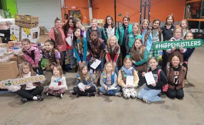 A group pictured in Second Harvest’s warehouse